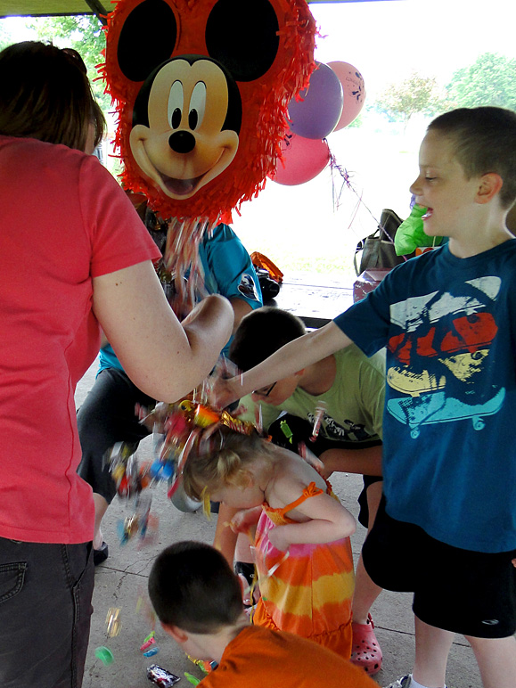 After getting the pi&ntilde;ata open, the candy poured over Kate's head (213.75 KB)